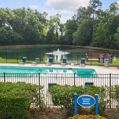 a swimming pool with a fence around it