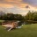 a dock with handicap ramp over a pond